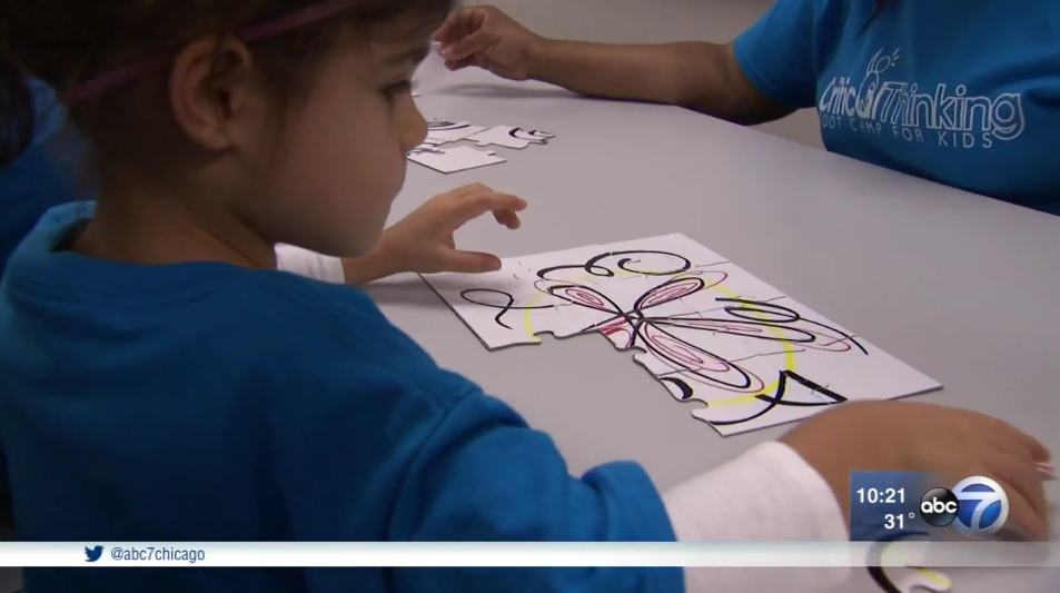 girl playing with puzzle